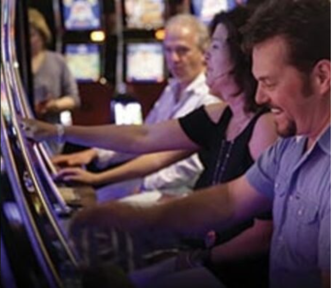 People enjoying a good time in the slot machine